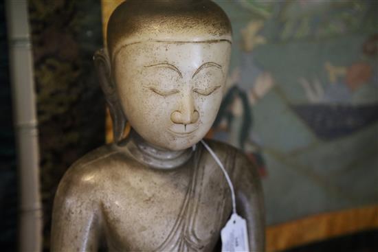 A large Burmese sculpted marble seated figure of Buddha, 18th/19th century H. 70cm, loss to ushnisha